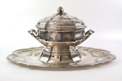 a silver plate with a silver bowl on it