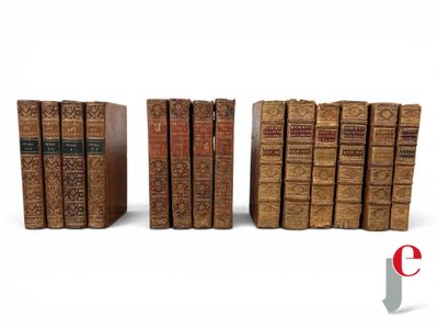 a group of books sitting on top of each other next to each other