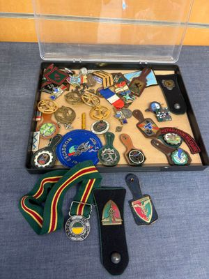 a case with a lot of medals and other items in it