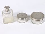 two salt and pepper shakers sitting next to each other