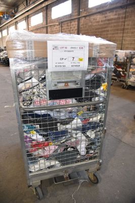 a cart with a lot of items in it in a warehouse