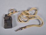a cell phone and a cord on a table