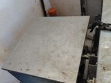 a stove that is sitting in the corner of a room