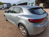 the rear end of a silver car parked in a parking lot