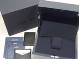 a box that has a wallet and a wallet case in it