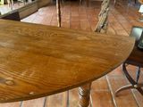 a wooden table with a bird on it in a restaurant