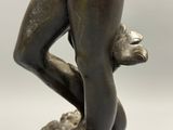 bronze statue of a woman holding a baby in her arms