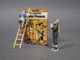 toy figurine of a man standing on a ladder next to a book