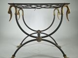 a black and gold console table with two horns on it
