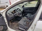 a white car with the door open sitting in a parking lot