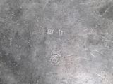 an antique silver plate with the word ' p ' engraved on it