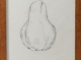 a pencil drawing of a pear in a wooden frame