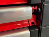 a machine that has a roll of paper on it