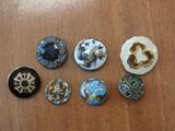 a lot of buttons that are on a table