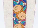 a white vase with a colorful design on it