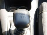 an image of a car ' s gear lever in the center console