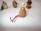 a small figurine of a person with a long nose