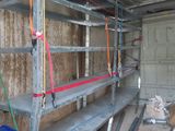 an image of a garage with a ladder and shelves