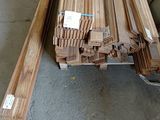 several pieces of wood are stacked on top of each other in a warehouse