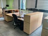 an image of an office with two desks and a chair