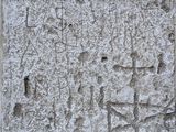 an image of a close up of a stone block with writing on it