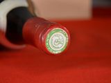 a close up of a bottle of wine on a table