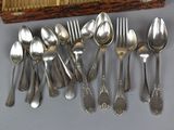 a lot of spoons and spoon spoons sitting on a table
