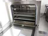 an open oven with a lot of food inside of it