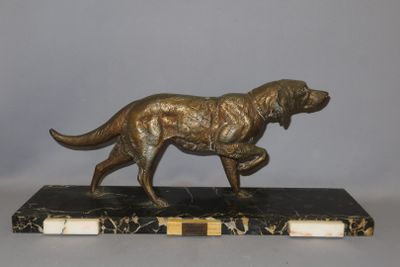 statue of a dog on a marble base on a gray background