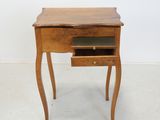 an image of a small table with a drawer on it