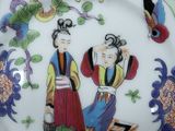 a plate with a picture of two people on it