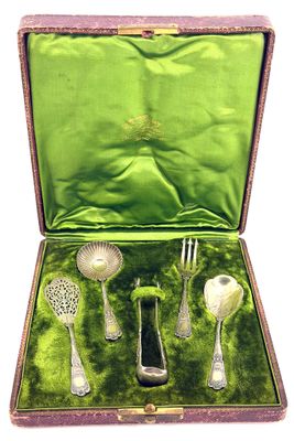 a green case with silverware in it on a white background