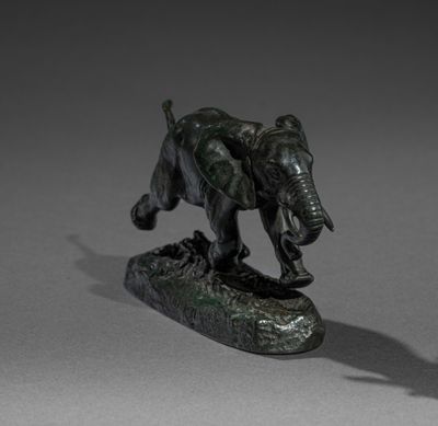 statue of an elephant on a rock with a shadow on a gray background