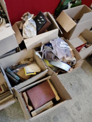 many boxes of books and other items in a room