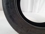 a close up of a tire on a white surface