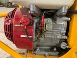 a small engine that is attached to the back of a vehicle