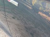a close up of a car door with a sticker on it