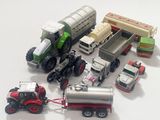 many toy trucks and trucks that are on the table