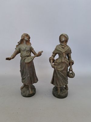 paire de figurines anciennes en bronze représentant une femme et un homme
