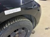 a close up of a car with a sticker on it ' s bumper