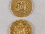 two gold coins, one of which has a coat of arms and the other with a crown on it