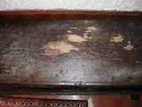 a wooden bench that has some dirt on it