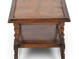 an old wooden table with a shelf on top of it