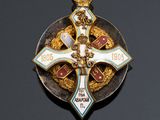 an image of a cross with a crown on top of it