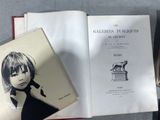 an open book with a picture of a girl on it