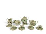 many pieces of porcelain tea and coffee set on the table