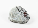 a close up of a rock that is on a white surface