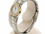 an image of a lady ' s wrist watch on a display stand