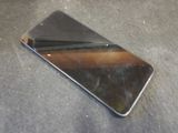 a cell phone that is laying on the ground