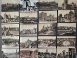 many pictures of a bunch of old buildings on the wall